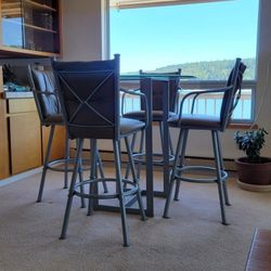 Glass Top Table with Leather Chairs