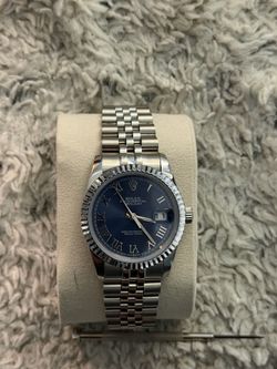 ($100) Rolex