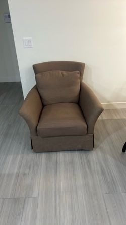 Crate and Barrel swivel arm chair