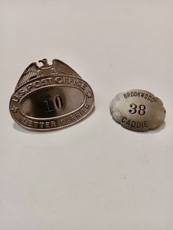 Vintage Advertising.  Two old Advertising post office and taxi badges. 