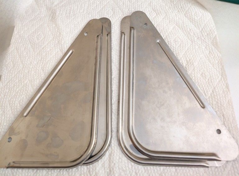 One Pair Of Small Metal Mud Flaps 7 1/2" High, 4 1/2 Across The Bottom. New Aluminum Or Stainless Steel. 2 Pr. Avail For Cars, Trailers. etc.