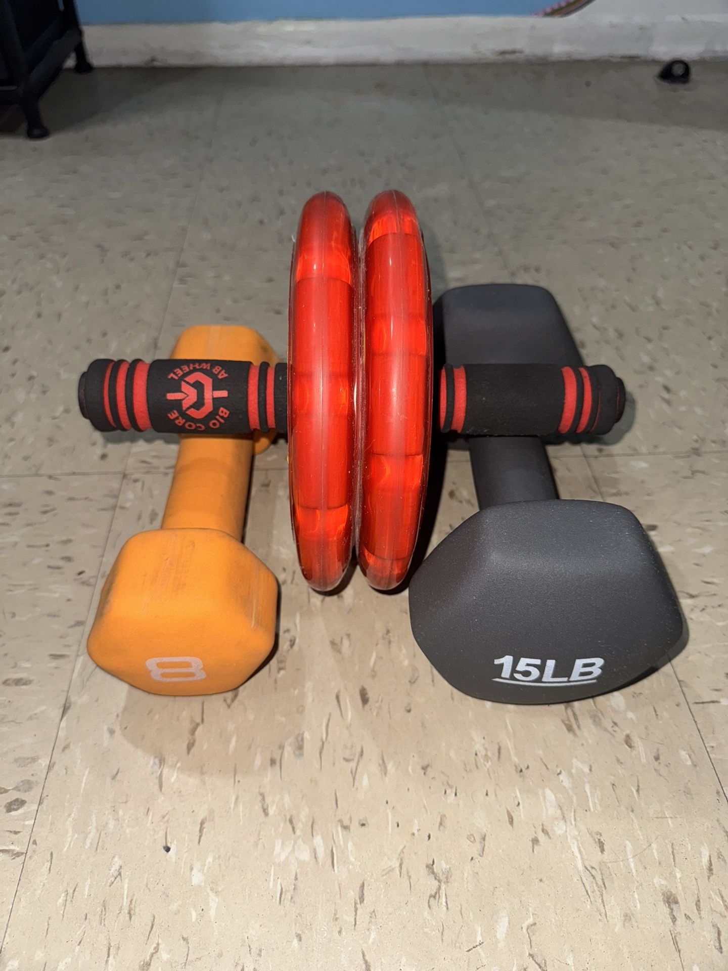 8lbs and 15lbs dumbbells and Ab Wheel