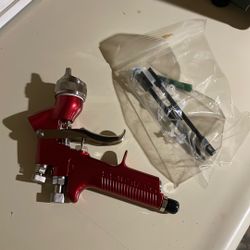 Paint gun brand new cost 1200 make me an offer and I have two