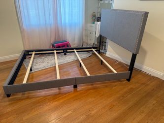 Queen size bed complete with like new bed frame. Only a year old like new.