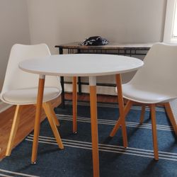 White Round Table To White Chairs.
