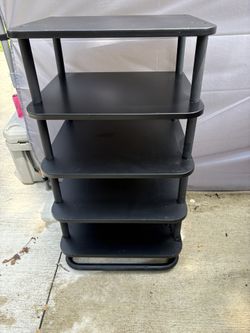 This could be used as an organizational piece in a bedroom and office. It could be used for records or to put any trinkets on. It’s metal and black wo