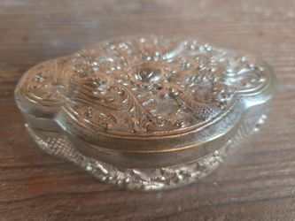 This object is an antique silver repousse trinket, pill, or snuff box,  (pewter) silver plated