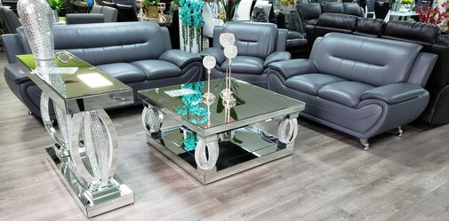 Amazing mirrored console and matching coffee table. Take them home today