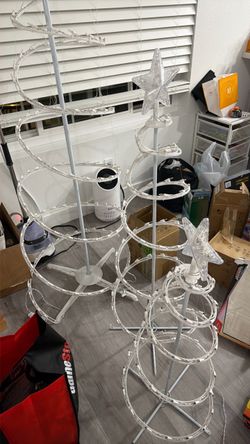 3 lighted spiral Christmas trees