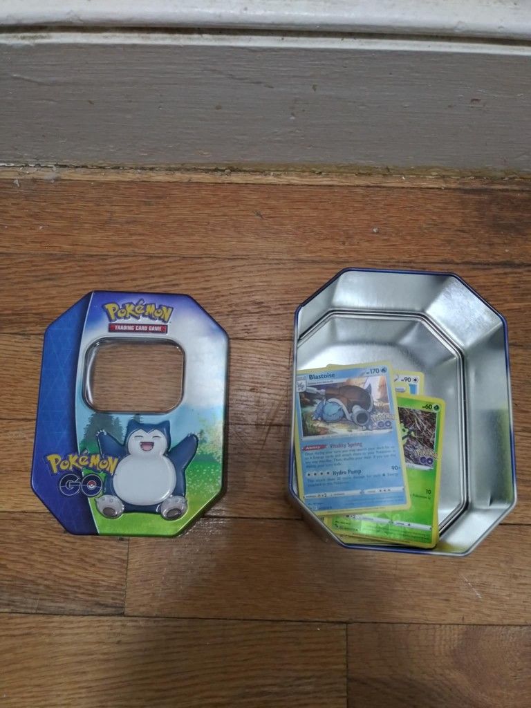 Tin Of Random Pokemon Cards 40 Cards Altogether 4 Holographic Cards. Message me anytime if interested will send more pictures or videos thank you.