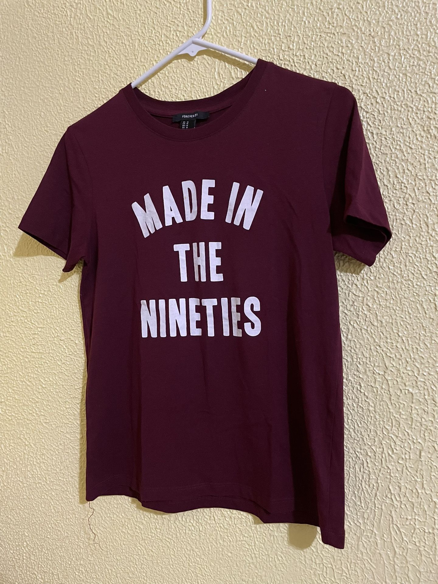 Burgundy Graphic Tshirt with "MADE IN THE NINETIES" printed in white