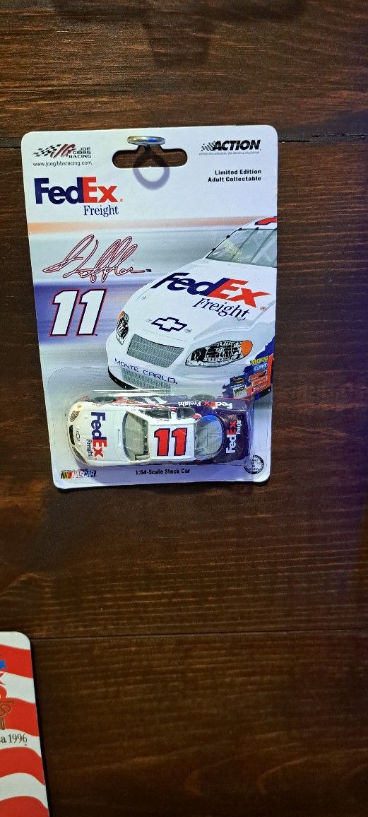 1:64 scale model is a replica of the Jason Leffler FedEx Kinko's NASCAR racecar from 2005.