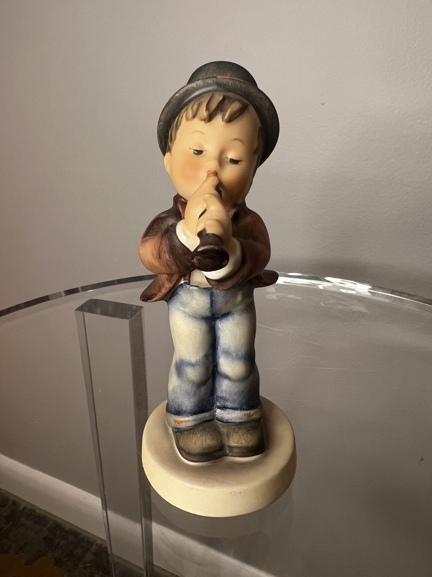 Goebel Hummel vintage figurine called "Serenade " #85/0, featuring a boy playing a horn