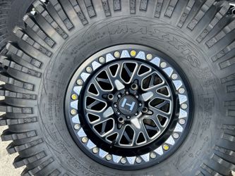 15x8 Can Am. Tires 35. Maxxis. Hostile Wheels
