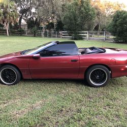 1997 Chevy Camaro convertible, With a LT one Corvette engine got over $7000 into it . The only thing wrong with it The glass on the convertible top i