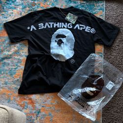 BAPE ( a bathing ape) black moon tee with big graphic moon ape head. Size large in men’s, never worn.