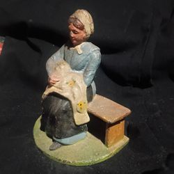 Vtg. Cast Iron Doorstop Bookend Country Amish Girl on Bench Sewing A Blanket