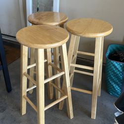 3 wooden barstools