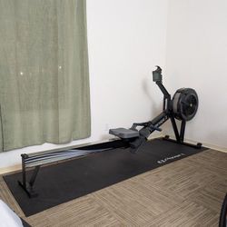 Concept2 Row Erg with PM5 monitor (with floor mat, phone holder, and optional wall hanger)