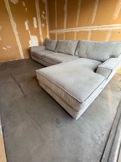 Large light grey sectional couch