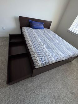 IKEA queen bed with 4 storage boxes