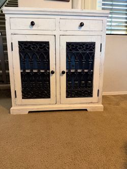 Distressed White Cabinet with Iron Scroll Doors