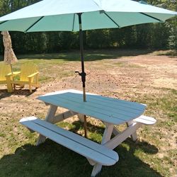Large picnic table with an umbrella