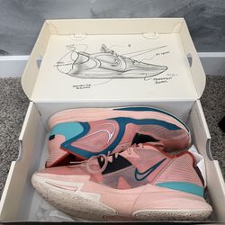 Nike Kyrie Low 5 pink and green basketball shoes.