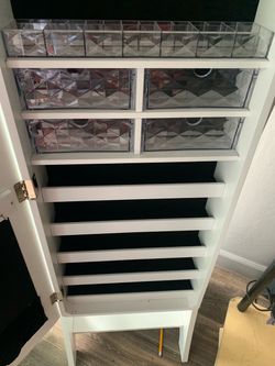 Tall tilting mirror jewelry cabinet