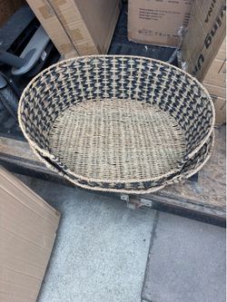 Large woven black and natural pet bed basket