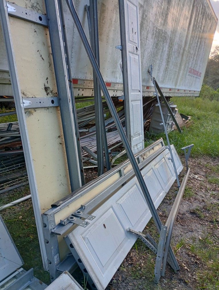 Two Complete Garage Door Assemblies
