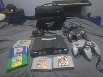 N64, all cords, 2 controllers, super smash bros, and other games