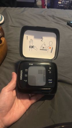n Omron wireless wrist blood pressure monitor,