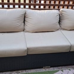 Wicker Patio Sofa With Sunbrella Covers On Cushions