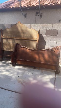 Queen-sized wooden sleigh bed