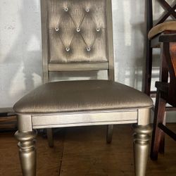 Modern contemporary metallic silver stud chair. 17 “high to seat , 20” wide, 41 “ high to top . $50 JUST ONE CHAIR
