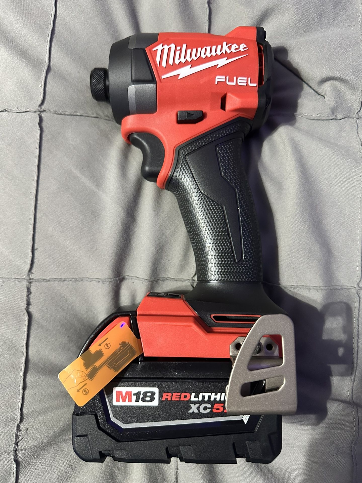 Milwaukee M18 FUEL 18V Lithium-Ion Brushless Cordless 1/4 in. Hex Impact Driver & XC 5.0 Battery