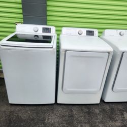 A pair of Samsung brand washing machines are gas and come with a 3-month warranty.