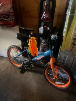 TODDLER BIKE, comes with training wheels.