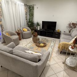 Very Clean Couch Set With Cushions Coffee Table, Rug, And A Throw Blanket