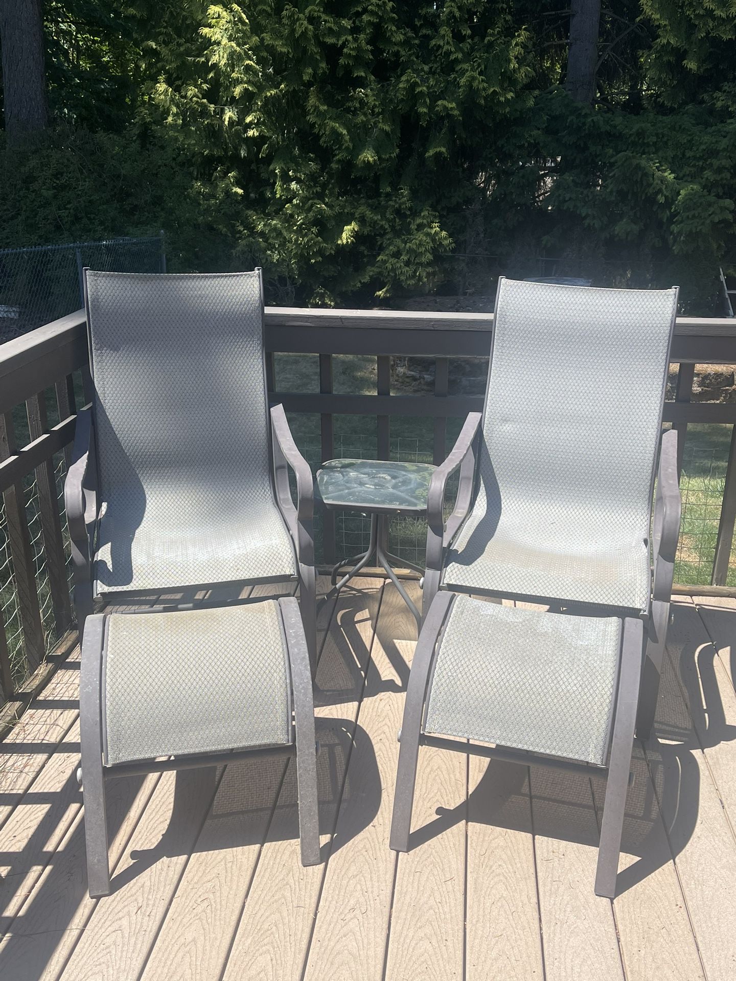 Lounge Deck Chairs w/ 2 Ottomans & A Small Table.
