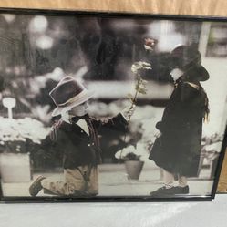 Boy Handing Girl A Flower