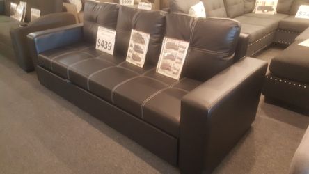 Brand new 84" x 57" black leather pullout futon