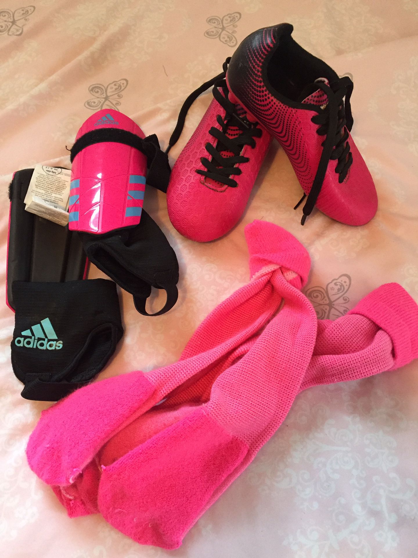 Pink soccer cleats size 10 girls, shin guards and socks