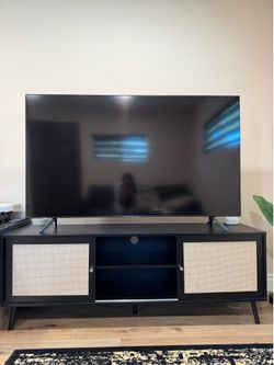 Mid-century modern entertainment stand with rattan doors