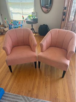 World market coral chairs with dark wood legs