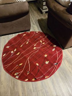Round red area rug.