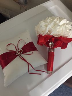 Wedding red and white pillow and flowers