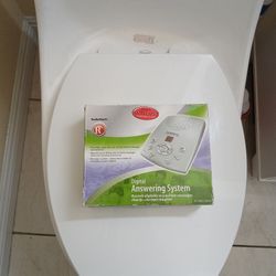 The Radio Shack Extended Capacity Digital Phone Answering System Model 43-3822 is a modern and sleek silver-colored unit with a 3.5mm jack connector. 