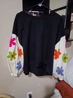 Cute black and white long sleeve top with colorful crochet flowers